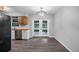 Dining room features modern light fixture, new flooring, and access to the back yard at 1209 Russell Dr, Ocoee, FL 34761