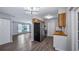 Open kitchen and living area with stainless steel appliances and bright natural light at 1209 Russell Dr, Ocoee, FL 34761