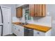 Updated kitchen design with wood countertops, stainless steel appliances, and bright backsplash at 1209 Russell Dr, Ocoee, FL 34761