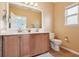 Bright bathroom features a double vanity, a well-lit mirror, and neutral tones, creating a clean and functional space at 12884 Calderdale Ave, Windermere, FL 34786