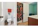 Functional bathroom with a toilet, shower with patterned curtain, and partial vanity provides a convenient and practical space at 12884 Calderdale Ave, Windermere, FL 34786