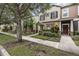 Charming townhome with landscaped yard, walkway, and a welcoming front porch entry at 12884 Calderdale Ave, Windermere, FL 34786
