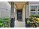 View of the front porch, showing a welcoming front door with decorative wreath at 12884 Calderdale Ave, Windermere, FL 34786