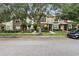 Pleasant street view of townhomes with shade trees and attractive landscaping at 12884 Calderdale Ave, Windermere, FL 34786