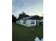 Exterior view of home with a white picket fence and spacious yard at 1425 26Th St, Orlando, FL 32805