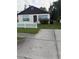 Charming home with traditional design, features a driveway at 1425 26Th St, Orlando, FL 32805