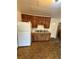 Kitchen featuring wooden cabinets and vintage flooring at 1425 26Th St, Orlando, FL 32805