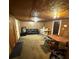 Living area features wood paneling and basic furnishings at 1425 26Th St, Orlando, FL 32805