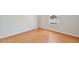 Empty bedroom showcasing laminate floors and a window that allows natural light at 14332 Grassy Cove Cir, Orlando, FL 32824