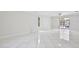 Spacious living room features sleek tile flooring and sliding glass doors leading to outdoor pool at 14332 Grassy Cove Cir, Orlando, FL 32824