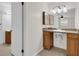 Bathroom includes a vanity sink with storage and granite countertop at 14402 Sw 34Th Terrace Rd, Ocala, FL 34473