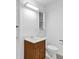 Bathroom with white walls, toilet, and sink with storage at 14402 Sw 34Th Terrace Rd, Ocala, FL 34473