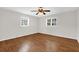 Spacious bedroom with hardwood floors and windows providing natural light at 14402 Sw 34Th Terrace Rd, Ocala, FL 34473