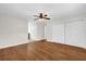 Bedroom features hardwood floors, ceiling fan and multiple closets at 14402 Sw 34Th Terrace Rd, Ocala, FL 34473