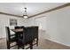 Bright dining room features neutral walls, decorative molding, tile floors and a chandelier at 14402 Sw 34Th Terrace Rd, Ocala, FL 34473