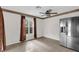Bright kitchen area with tile flooring, neutral walls, and stainless steel refrigerator at 14402 Sw 34Th Terrace Rd, Ocala, FL 34473