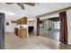 Open-concept kitchen with wooden cabinets, tile flooring, and seamless access to a dining area at 14402 Sw 34Th Terrace Rd, Ocala, FL 34473