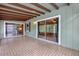 Covered patio with tile flooring and sliding glass doors leading into the home at 14402 Sw 34Th Terrace Rd, Ocala, FL 34473