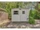 Shed in backyard with a window and door, providing extra storage space at 14402 Sw 34Th Terrace Rd, Ocala, FL 34473