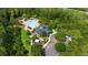 Aerial view of the community clubhouse with a pool, playground, and lush landscaping at 15258 Windmill Harbor Ct, Orlando, FL 32828