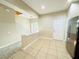 Spacious entryway with tile floors, staircase, and access to the kitchen and living areas at 15258 Windmill Harbor Ct, Orlando, FL 32828