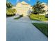 Charming townhome featuring a two-car garage, well-maintained landscaping, and a welcoming facade at 15258 Windmill Harbor Ct, Orlando, FL 32828
