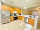 Well-equipped kitchen featuring stainless steel appliances and ample cabinet space at 15258 Windmill Harbor Ct, Orlando, FL 32828