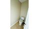 Practical toilet with neutral walls and tile flooring, a simple and clean space at 15258 Windmill Harbor Ct, Orlando, FL 32828