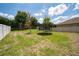 Large backyard with green grass, a trampoline, and a soccer net for recreational fun at 15716 Sweet Lemon Way, Winter Garden, FL 34787