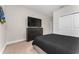 Bedroom featuring neutral walls, carpet, dark wood dresser, and king bed at 15716 Sweet Lemon Way, Winter Garden, FL 34787