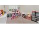Playroom featuring a dollhouse, play kitchen and many toys for entertainment at 15716 Sweet Lemon Way, Winter Garden, FL 34787