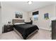 Cozy bedroom featuring neutral walls, carpet, desk, and dark wood furniture at 15716 Sweet Lemon Way, Winter Garden, FL 34787