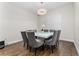 Cozy dining area with a modern chandelier and seating for eight at 15716 Sweet Lemon Way, Winter Garden, FL 34787