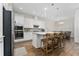 Modern kitchen with stainless steel appliances and a center island with seating at 15716 Sweet Lemon Way, Winter Garden, FL 34787