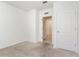 Spacious bedroom featuring neutral carpet and an open doorway at 1864 Green Dragon Dr, St Cloud, FL 34771
