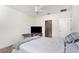 Bedroom features a ceiling fan, and an ensuite bathroom at 1864 Green Dragon Dr, St Cloud, FL 34771