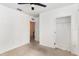 Bedroom featuring ceiling fan, carpet flooring and closet space at 1864 Green Dragon Dr, St Cloud, FL 34771