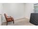 Cozy bedroom with a window and an ornate chair, bathed in natural light at 1864 Green Dragon Dr, St Cloud, FL 34771