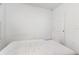 A bright bedroom with a comfortable mattress on the floor next to the door at 1864 Green Dragon Dr, St Cloud, FL 34771