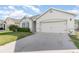 Attractive single-Gathering home with a spacious driveway and a manicured lawn at 1864 Green Dragon Dr, St Cloud, FL 34771