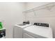 Functional laundry area with modern, white washer and dryer units at 1864 Green Dragon Dr, St Cloud, FL 34771