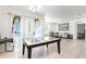 A large living room with sliding glass doors and an adjacent dining area at 1864 Green Dragon Dr, St Cloud, FL 34771