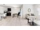 Open-concept living area with tile floors, modern furnishings, and ample natural light at 1864 Green Dragon Dr, St Cloud, FL 34771