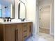 Beautiful bathroom with double sink vanity, marble countertops, and a walk-in closet at 2118 Donegan Pl, Orlando, FL 32826