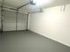 Clean, freshly painted garage with overhead door and ample space at 2118 Donegan Pl, Orlando, FL 32826