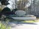 Community entrance sign 'The Estates at Park Central' with manicured landscaping at 2406 Grand Central Pkwy # 14, Orlando, FL 32839