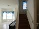 A combination of living space, staircase, and window with valance at 2406 Grand Central Pkwy # 14, Orlando, FL 32839
