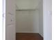 Spacious walk-in closet with wire shelving and laminate floors is ready to be organized at 2406 Grand Central Pkwy # 14, Orlando, FL 32839