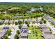 Aerial view of a residential area showcasing nearby lakes, trees, and community layout at 251 Domus Ln, Casselberry, FL 32707