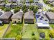 A high-angle view showcases the layout of the backyard and its position relative to the neighboring properties at 251 Domus Ln, Casselberry, FL 32707